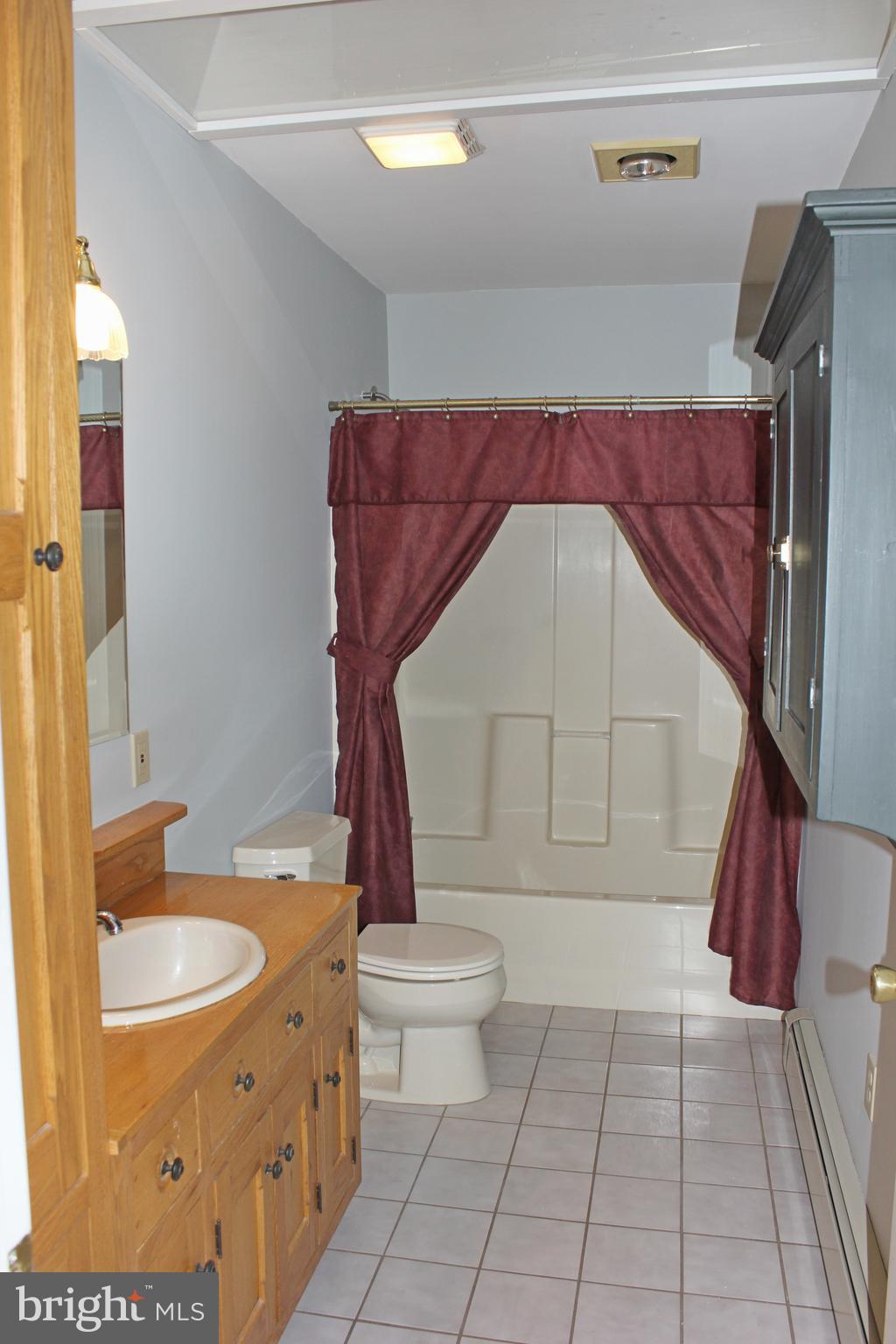 53 North Oak Street Lititz, PA 17543 - Photo 8 of 33 a bathroom with a granite countertop sink a toilet and a mirror