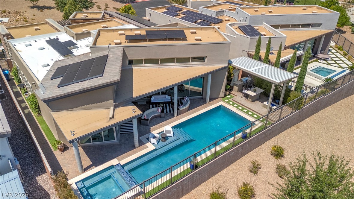 6014 Willow Ridge Court Las Vegas, NV 89135 - Photo 87 of 99 An aerial view showcases this striking modern residence, featuring a pool and sleek solar panels.