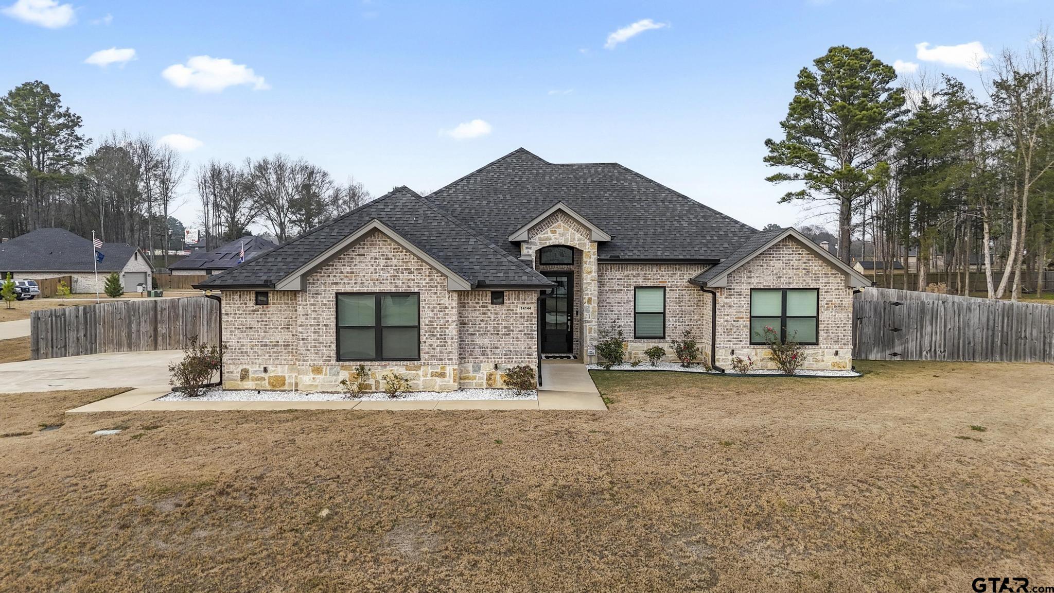 14144 Foxtail Drive Flint, TX 75762 - Photo 1 of 39 a front view of a house with a view of a house