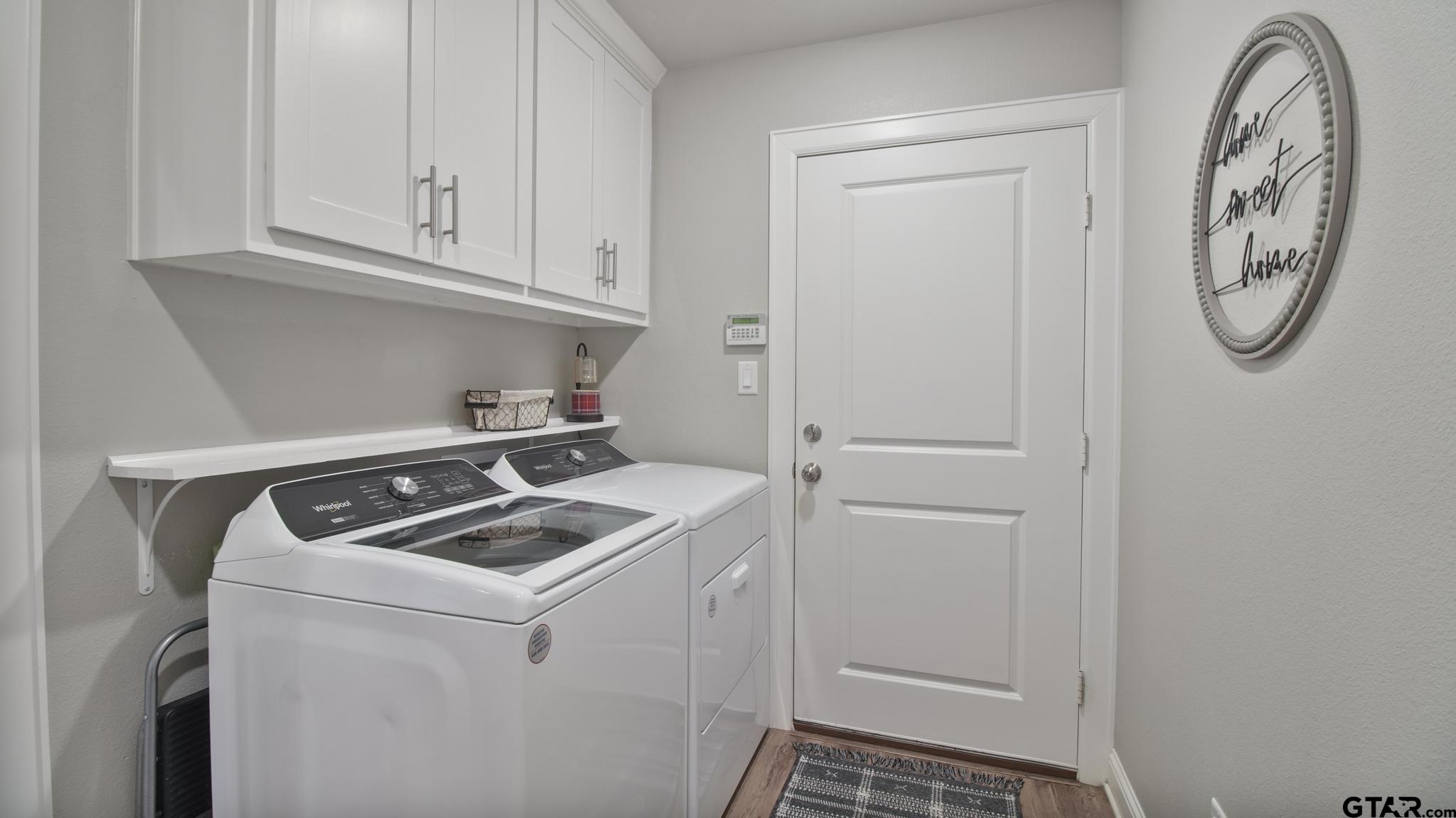 14144 Foxtail Drive Flint, TX 75762 - Photo 28 of 39 a room with storage and utility racks on th wall