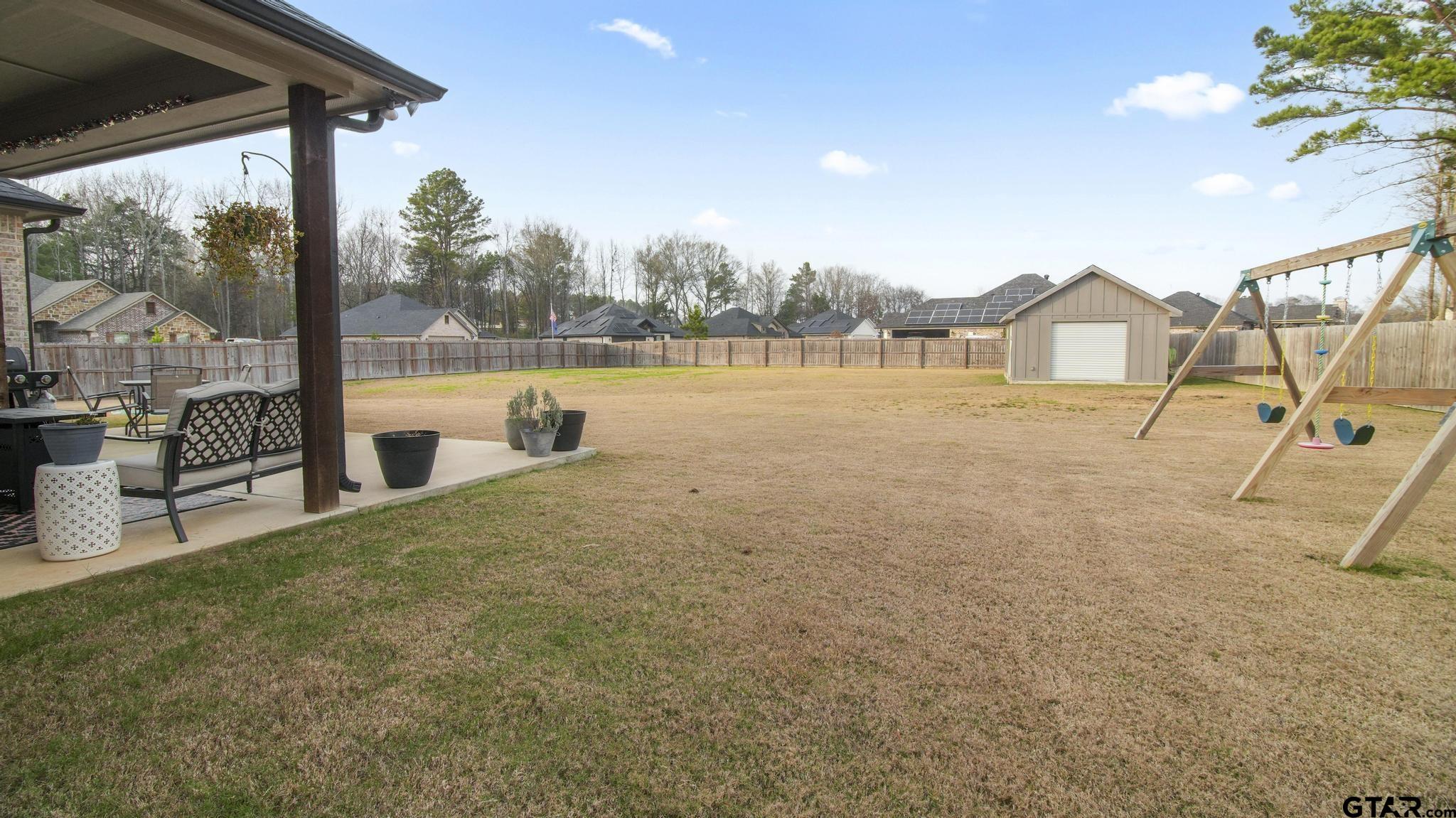14144 Foxtail Drive Flint, TX 75762 - Photo 32 of 39 a view of a lake with a house in the background