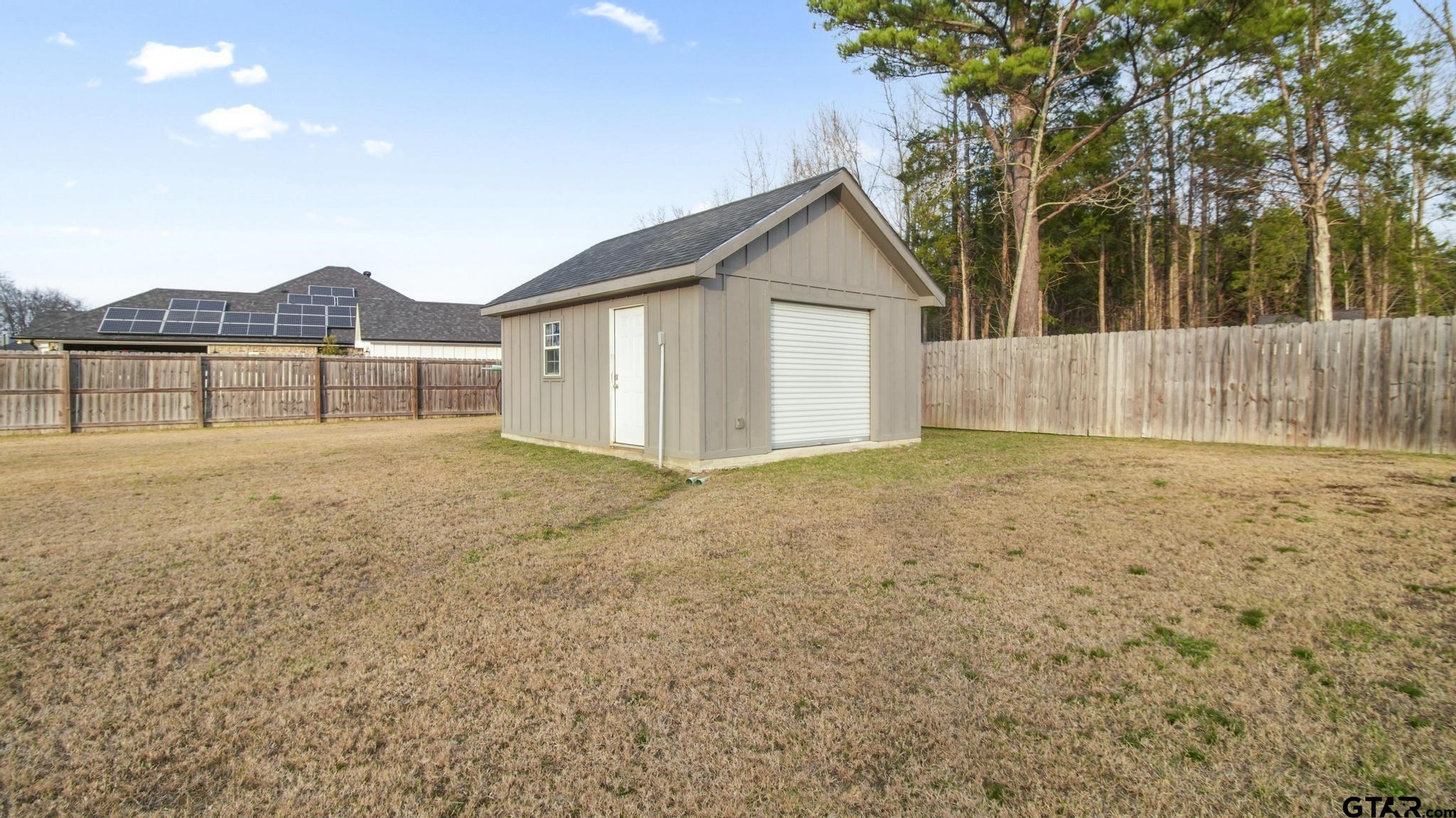 14144 Foxtail Drive Flint, TX 75762 - Photo 34 of 39 a view of house with backyard and trees