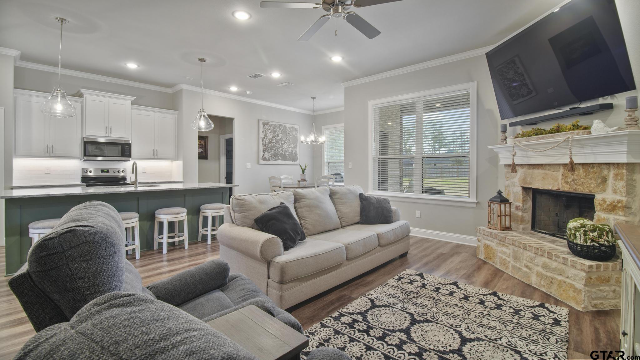 14144 Foxtail Drive Flint, TX 75762 - Photo 7 of 39 a living room with furniture and a fireplace