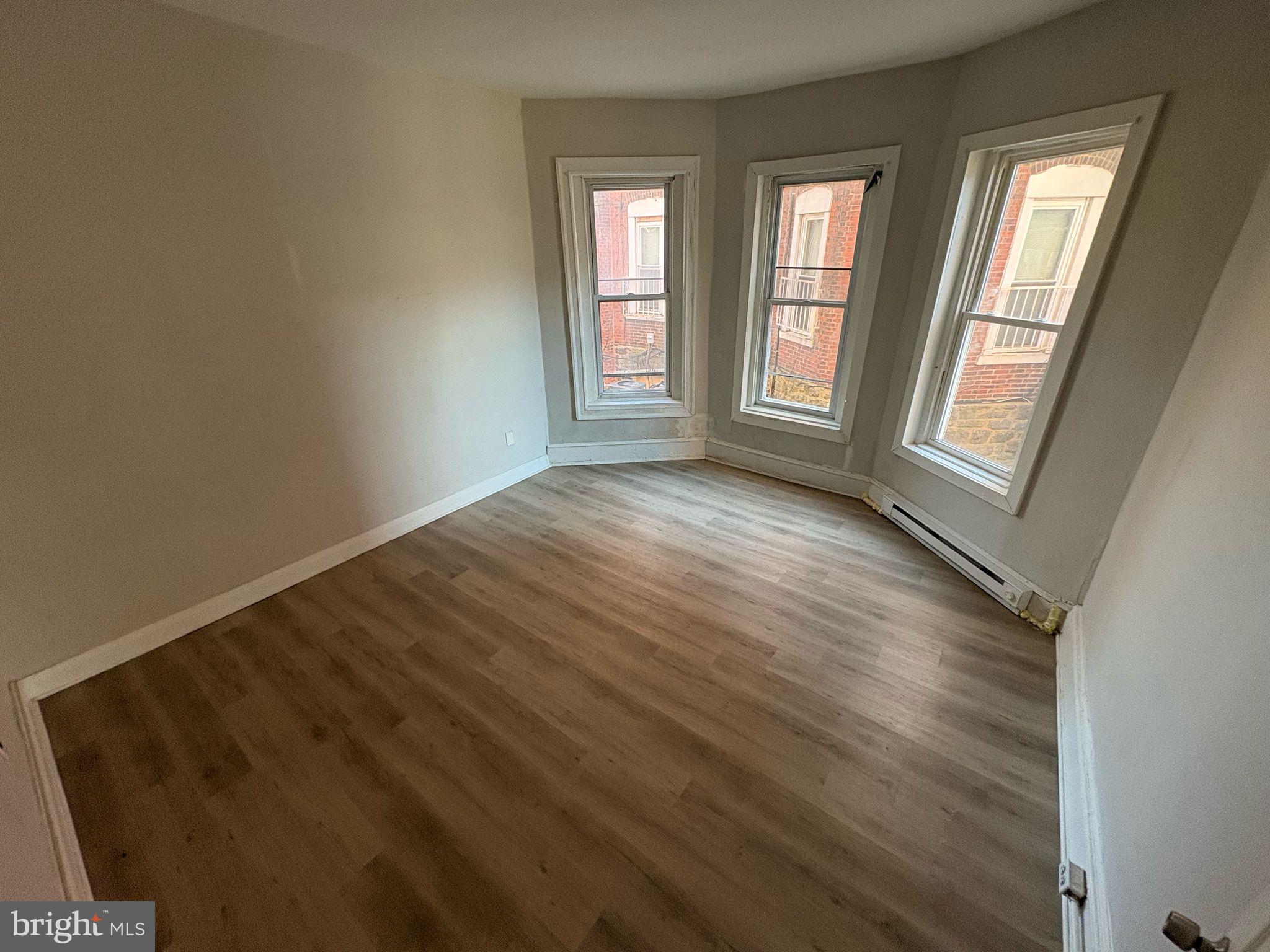 861 Wynnewood Road, Unit 1 Philadelphia, PA 19151 - Photo 2 of 5 a view of an empty room and window