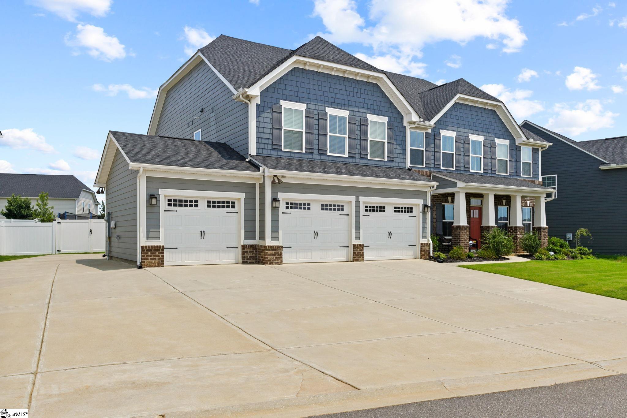 18 Blackfoot Road Greenville, SC 29607 - Photo 2 of 36 Extended cement driveway for parking and RV 30 amp hookup on side.