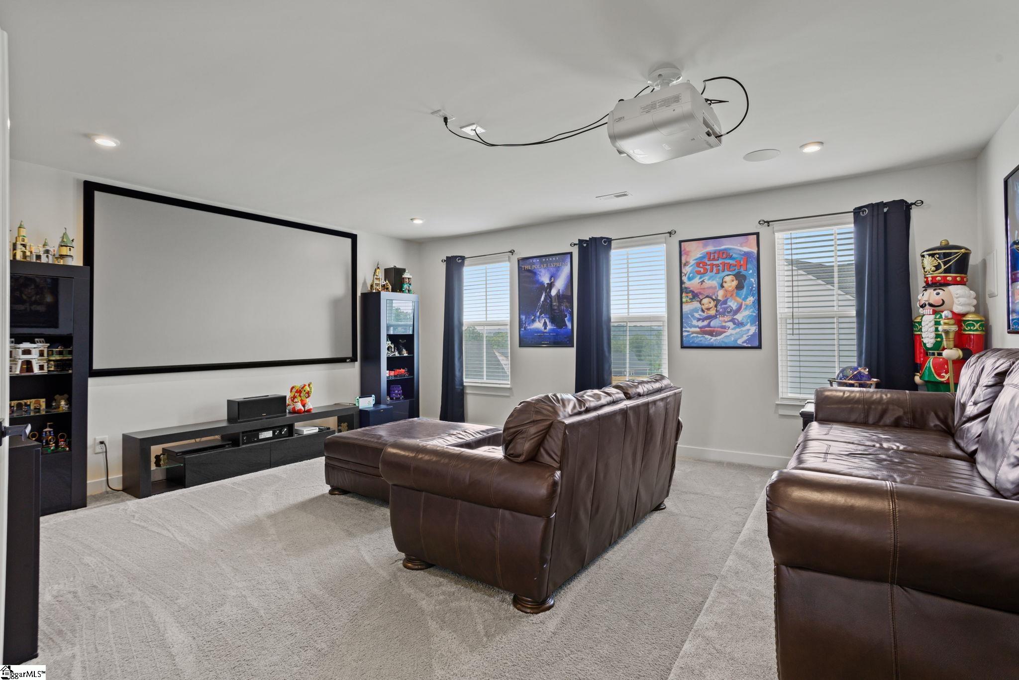 18 Blackfoot Road Greenville, SC 29607 - Photo 23 of 36 16'9" x18'3" cinema / multi-media room complete with surround sound, wall TV and seating!