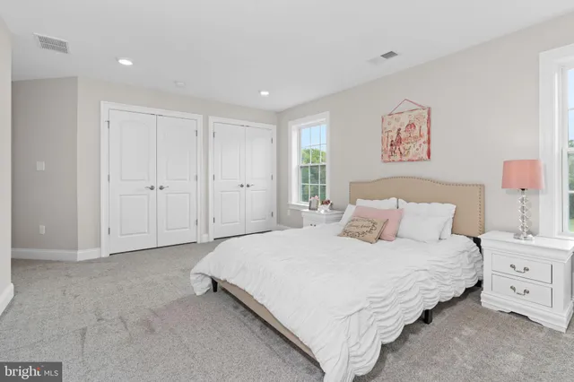 a bedroom with a bed and a cabinets