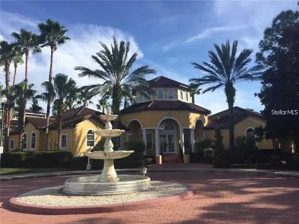 a front view of a house with a yard garage and outdoor seating