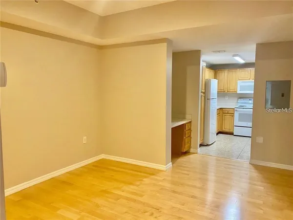 a view of empty room with a fireplace