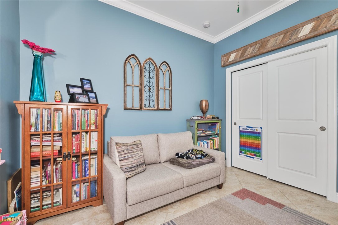 11856 Arboretum Run Drive, Unit 102 Fort Myers, FL 33913 - Photo 19 of 47 a living room with baby crib furniture and baby crib