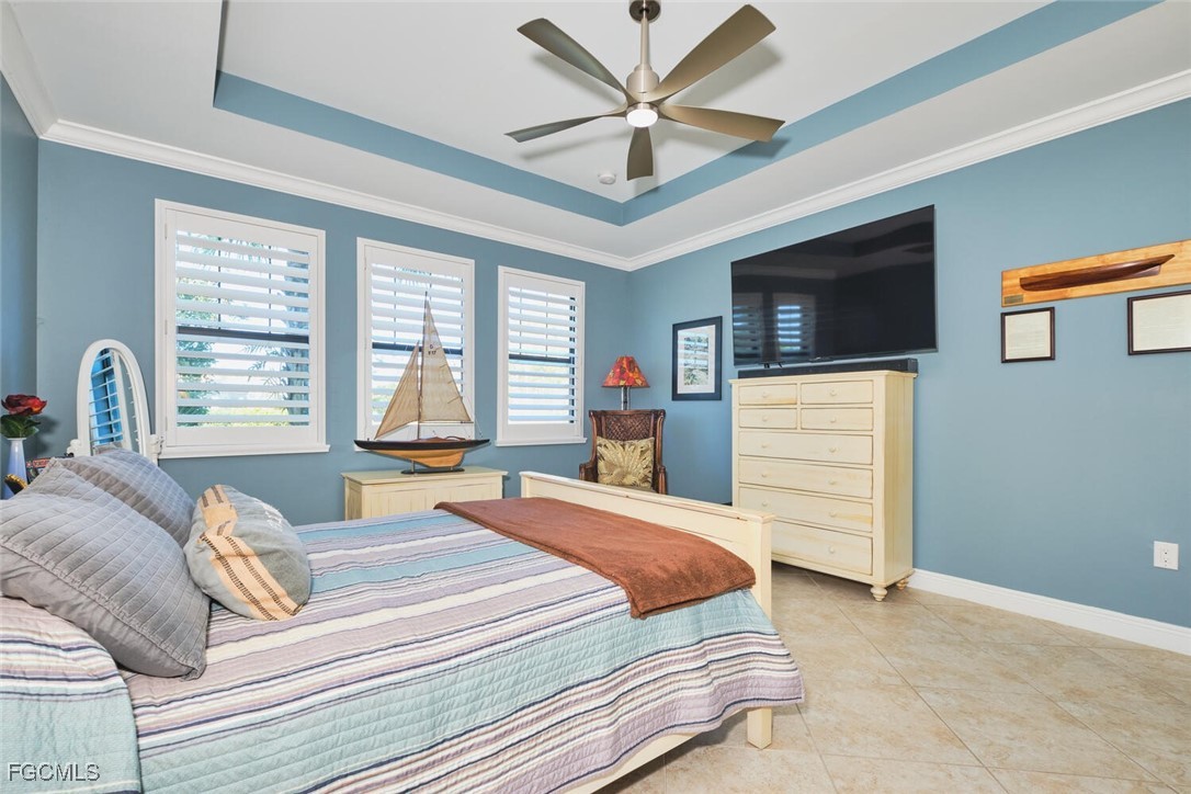 11856 Arboretum Run Drive, Unit 102 Fort Myers, FL 33913 - Photo 20 of 47 a bedroom with a bed and a large window