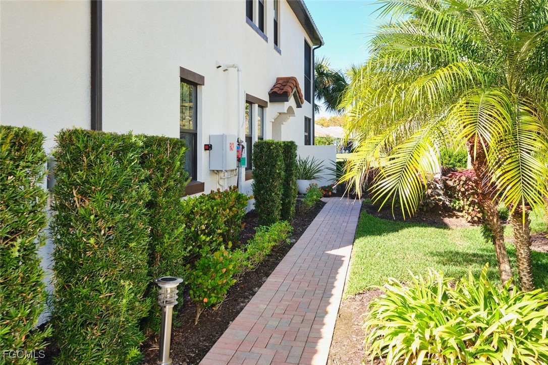 11856 Arboretum Run Drive, Unit 102 Fort Myers, FL 33913 - Photo 2 of 47 a view of a garden with potted plants