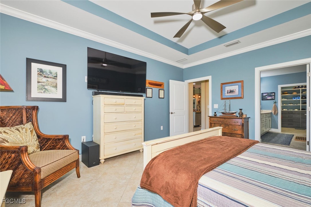 11856 Arboretum Run Drive, Unit 102 Fort Myers, FL 33913 - Photo 21 of 47 a bedroom with a bed and a chandelier