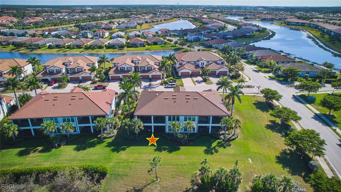 11856 Arboretum Run Drive, Unit 102 Fort Myers, FL 33913 - Photo 33 of 47 an aerial view of house with yard and mountain view in back