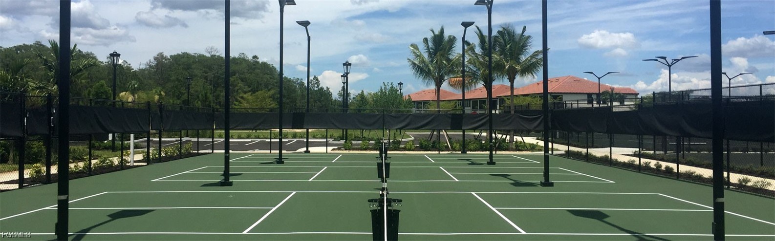 11856 Arboretum Run Drive, Unit 102 Fort Myers, FL 33913 - Photo 40 of 47 a tennis court that has potted plants