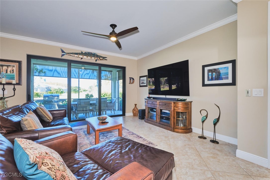 11856 Arboretum Run Drive, Unit 102 Fort Myers, FL 33913 - Photo 5 of 47 a living room with furniture a ceiling fan and a flat screen tv