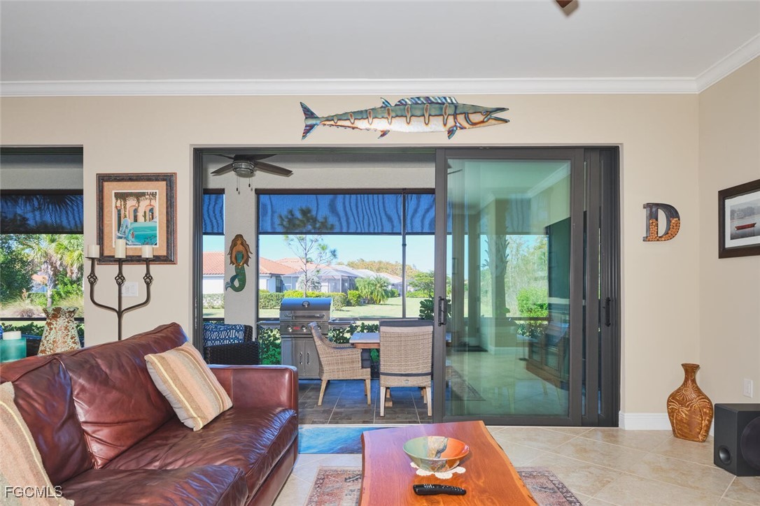 11856 Arboretum Run Drive, Unit 102 Fort Myers, FL 33913 - Photo 8 of 47 a living room with furniture and a large window