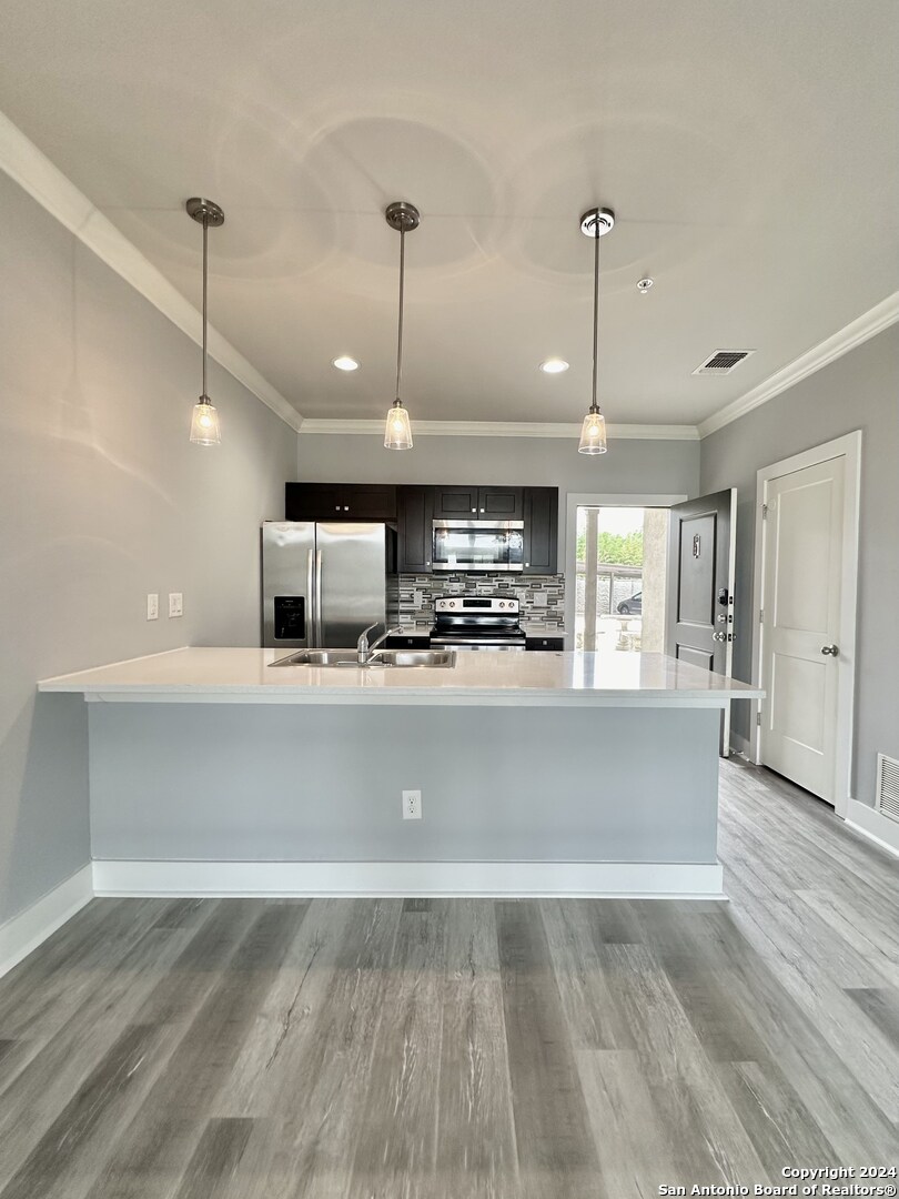 a view of counter top space and kitchen view