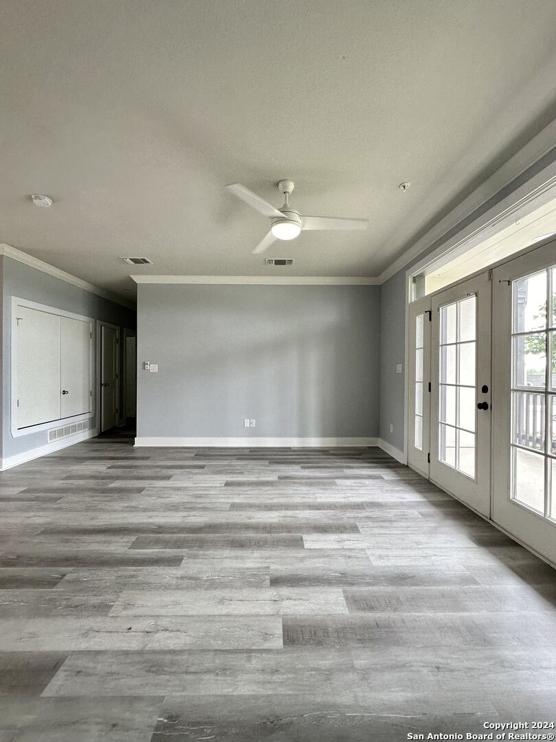 831 Terrell Road, Unit 103 San Antonio, TX 78209 - Photo 3 of 11 a view of an empty room with a window