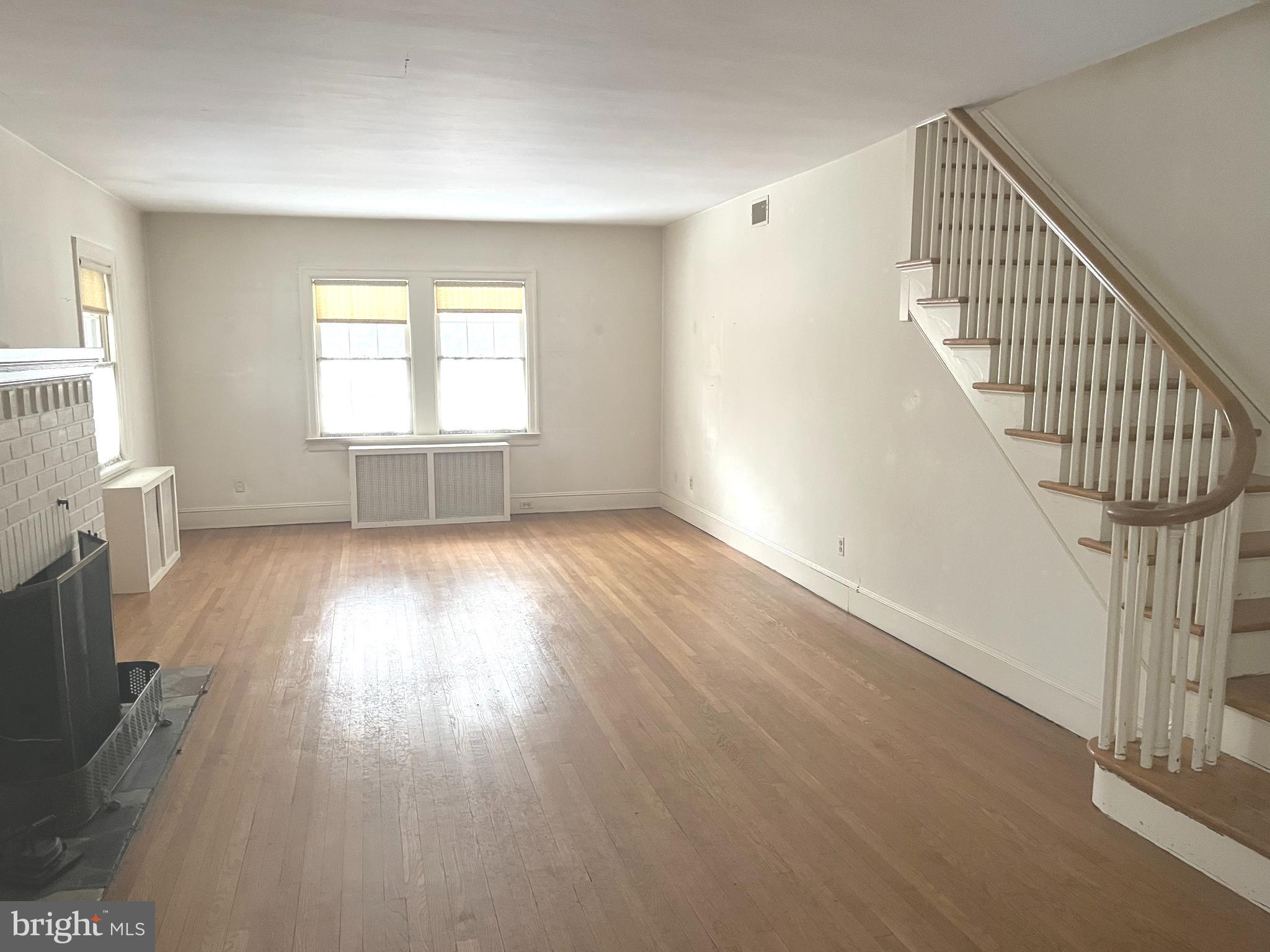 1802 Yardley Morrisville Road Yardley, PA 19067 - Photo 14 of 39 wooden floor in an empty room with a window