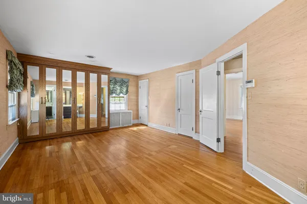 a view of an empty room with glass door