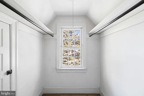 a view of a hallway with windows