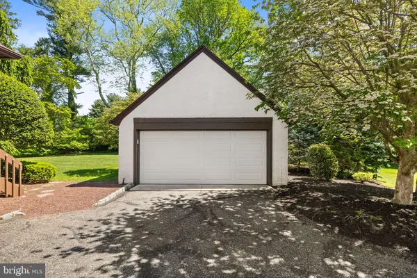 a view of a house with a yard and garage