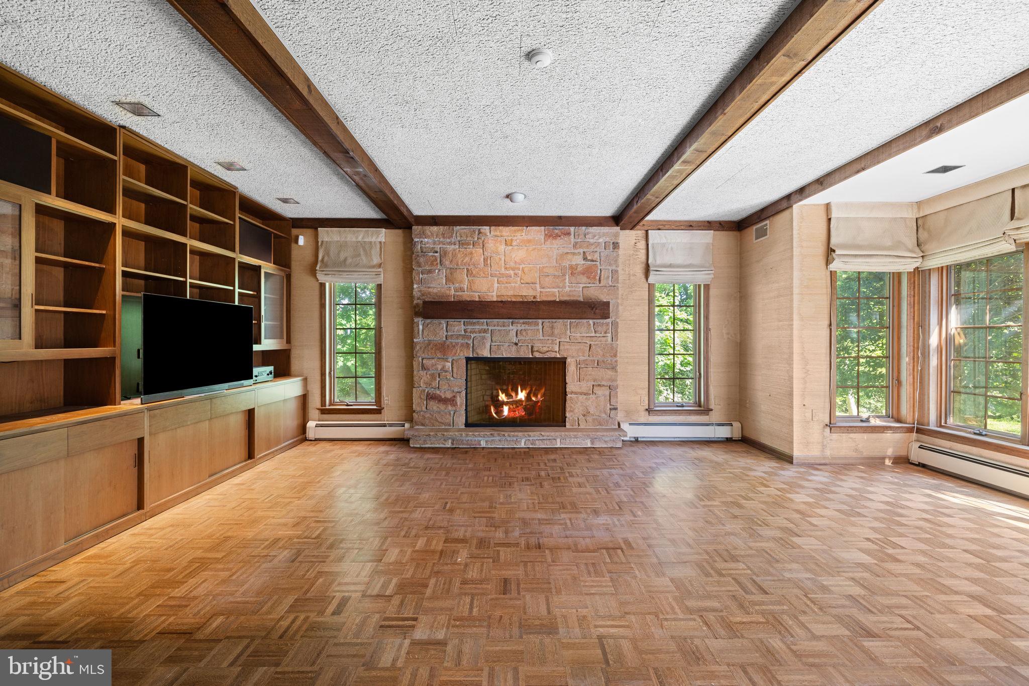 1802 Yardley Morrisville Road Yardley, PA 19067 - Photo 7 of 39 a view of an empty room with a fireplace and a window