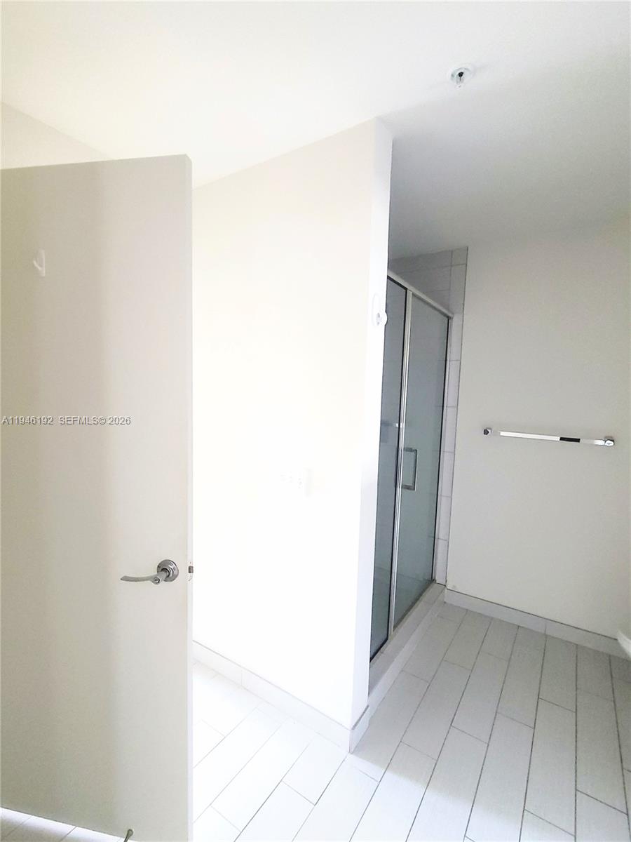 999 Southwest 1st Avenue, Unit 1808 Miami, FL 33130 - Photo 13 of 16 a view of a closet area