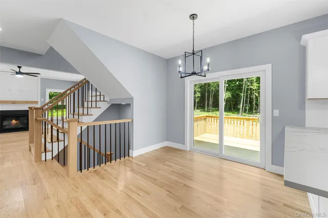 a kitchen with stainless steel appliances granite countertop a sink stove and wooden floor