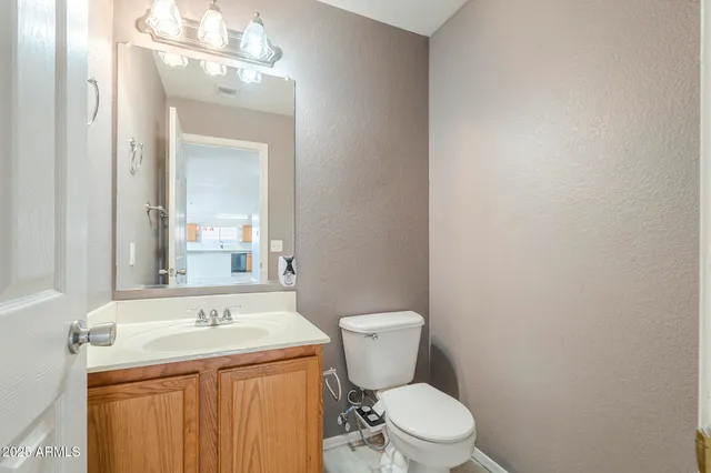a view of a livingroom with furniture and an empty room