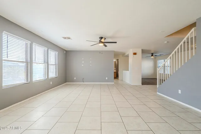 a large kitchen with kitchen island a large counter space and a sink