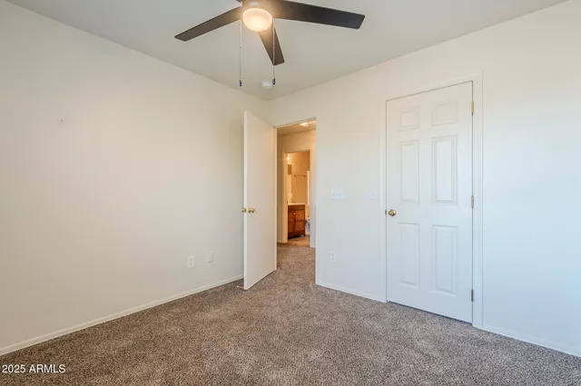 a view of an empty room with a bathroom