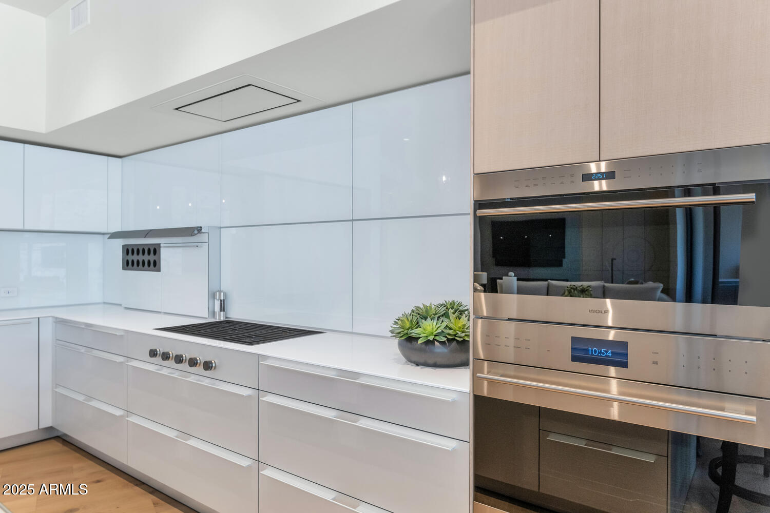 5000 East Camelback Road, Unit 407 Scottsdale, AZ 85253 - Photo 11 of 39 a kitchen with stainless steel appliances a stove and a microwave