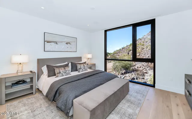 a bedroom with a large bed and a window