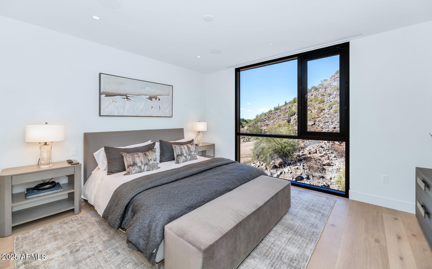 5000 East Camelback Road, Unit 407 Scottsdale, AZ 85253 - Photo 19 of 39 a bedroom with a large bed and a window