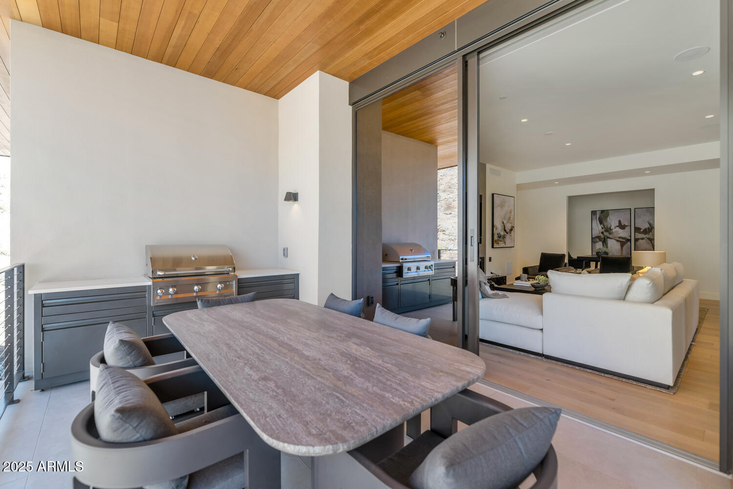 5000 East Camelback Road, Unit 407 Scottsdale, AZ 85253 - Photo 23 of 39 a living room with furniture and a table
