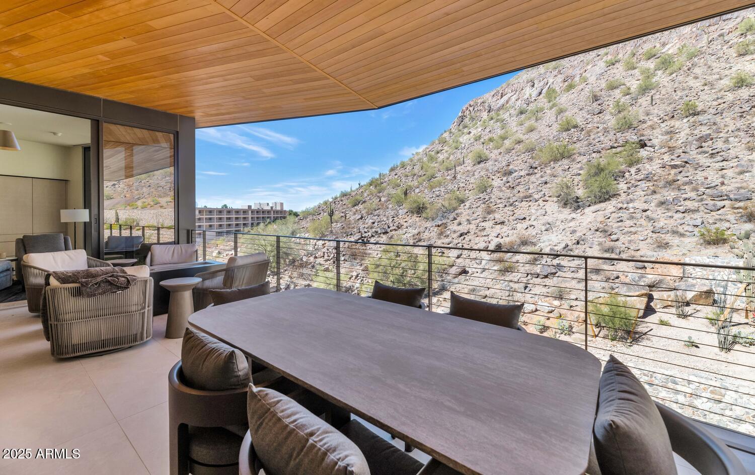 5000 East Camelback Road, Unit 407 Scottsdale, AZ 85253 - Photo 25 of 39 a view of roof deck with couches and wooden floor