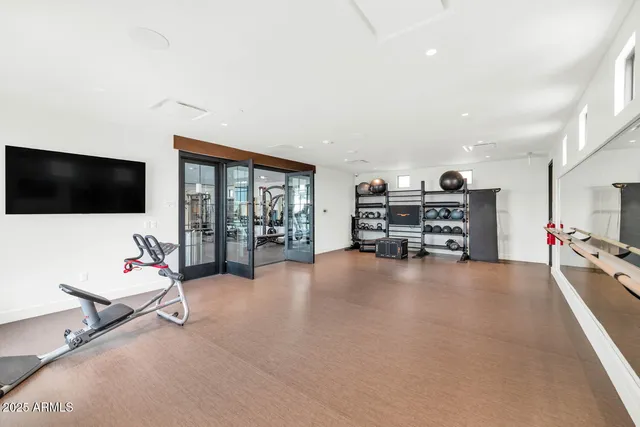 a view of a livingroom with furniture and a flat screen tv