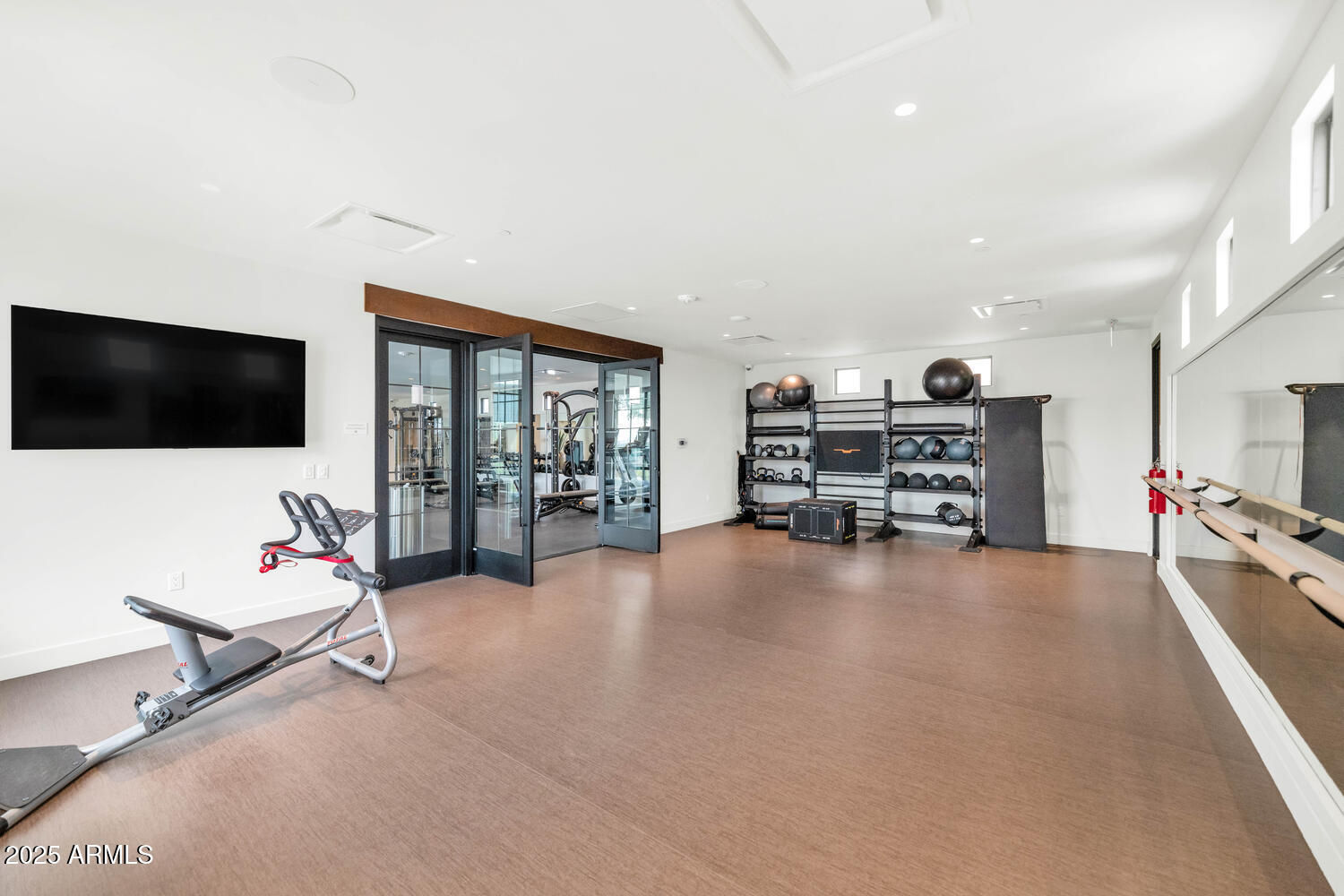 5000 East Camelback Road, Unit 407 Scottsdale, AZ 85253 - Photo 30 of 39 a view of a livingroom with furniture and a flat screen tv