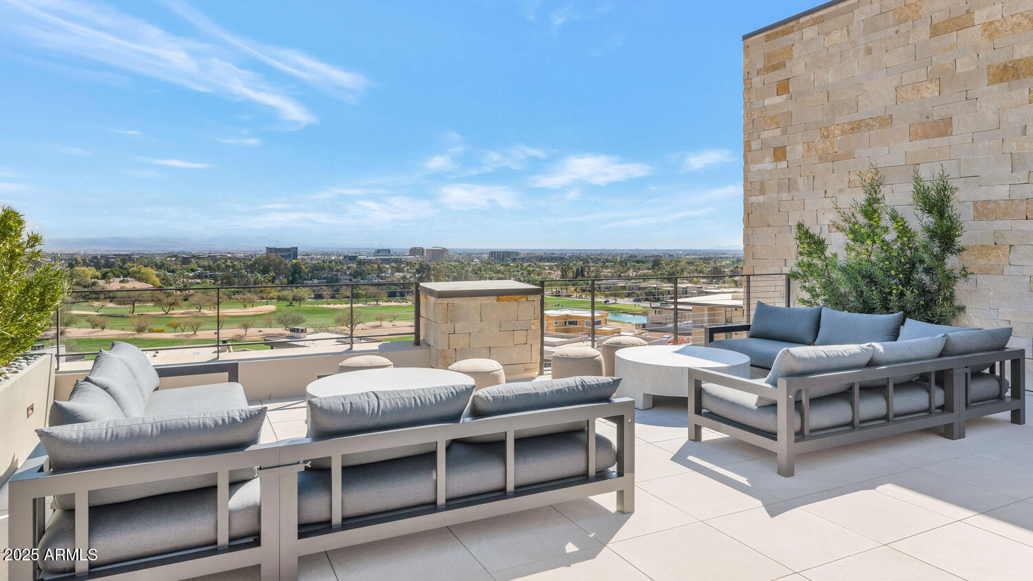 5000 East Camelback Road, Unit 407 Scottsdale, AZ 85253 - Photo 34 of 39 a view of a terrace with couches and lounge chairs