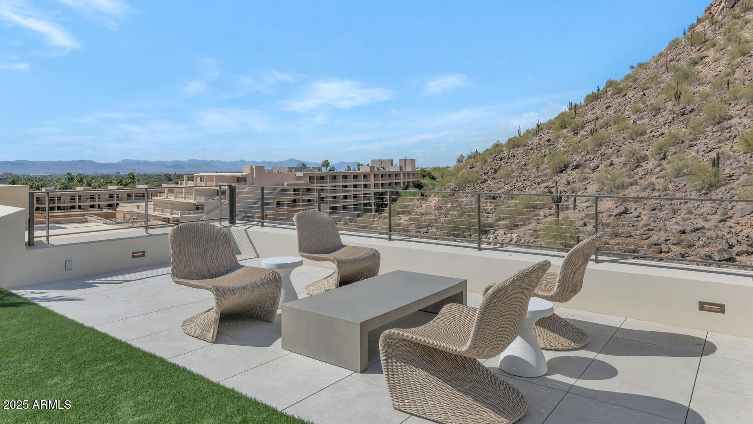5000 East Camelback Road, Unit 407 Scottsdale, AZ 85253 - Photo 36 of 39 a view of a terrace with couches and sky view