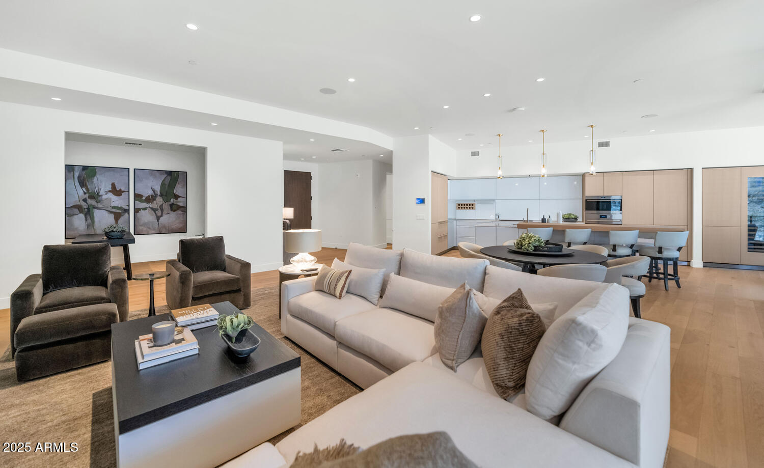 5000 East Camelback Road, Unit 407 Scottsdale, AZ 85253 - Photo 5 of 39 a living room with furniture and kitchen view