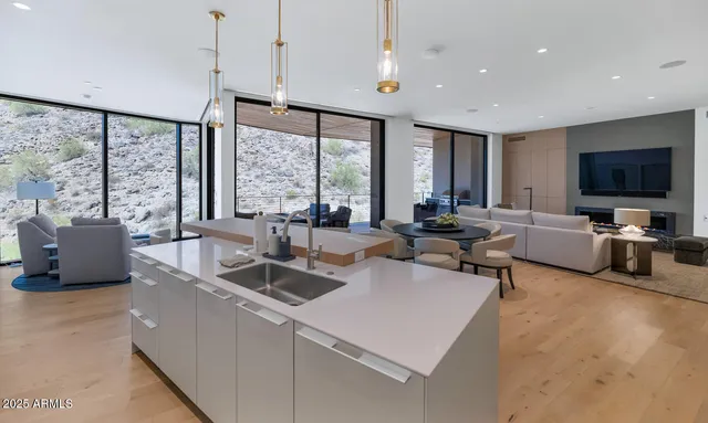 a living room with furniture and large flat screen tv
