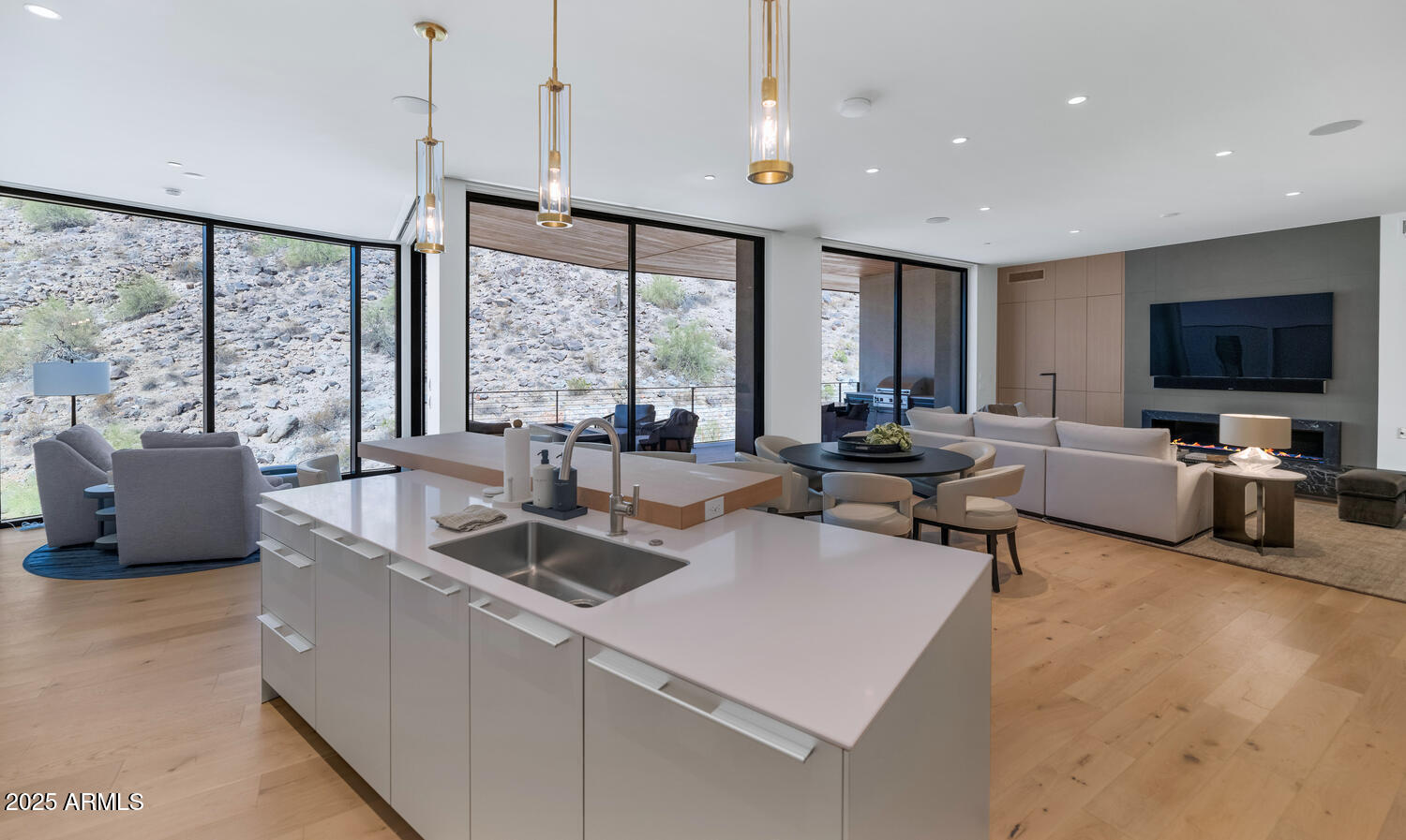 5000 East Camelback Road, Unit 407 Scottsdale, AZ 85253 - Photo 8 of 39 a living room with furniture and large flat screen tv