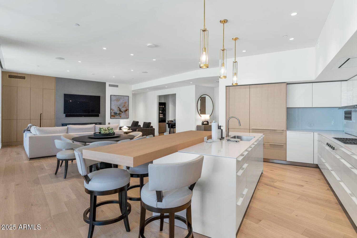 5000 East Camelback Road, Unit 407 Scottsdale, AZ 85253 - Photo 10 of 39 a large white kitchen with a table and chairs