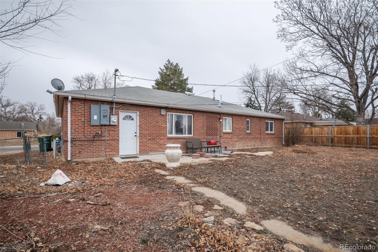 840 Tucson Street Aurora, CO 80011 - Photo 24 of 29 a view of a house with a yard and sitting area