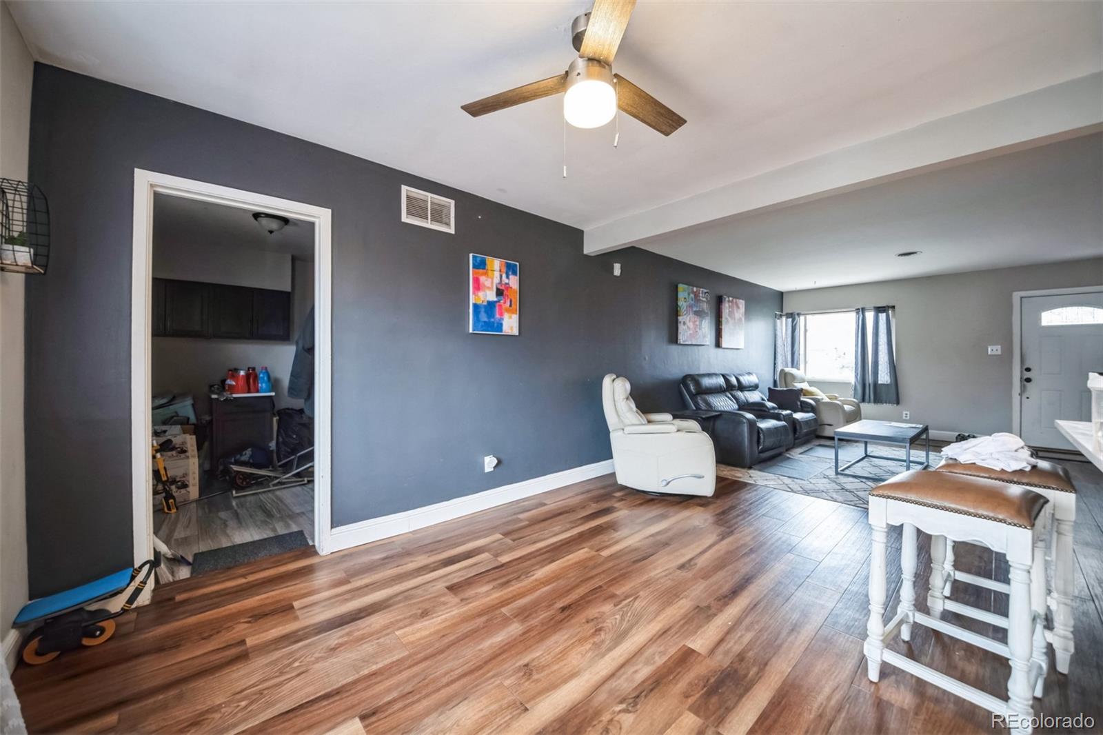840 Tucson Street Aurora, CO 80011 - Photo 9 of 29 a living room with furniture and wooden floor
