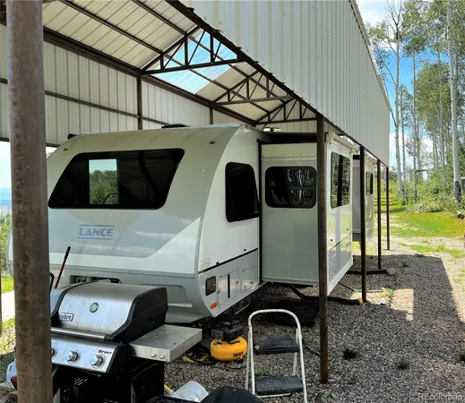 a kitchen with a refrigerator sink and stove