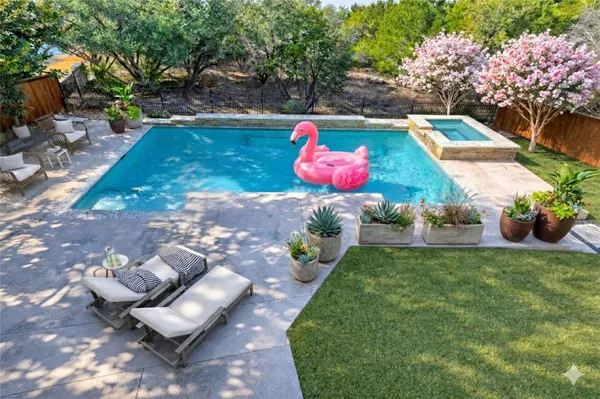 a view of a backyard with sitting area